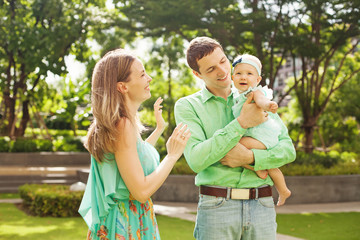 Family with baby in park