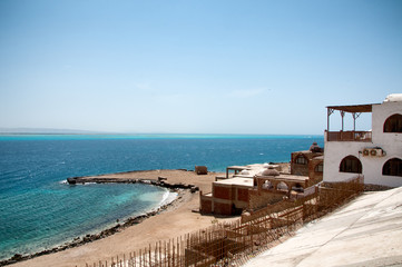 Fototapeta na wymiar Buildings on Coastline of Red Sea in Hurghada