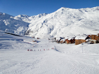 Ski slope at Les Menuires resort, snow winter sports in the Alps, France