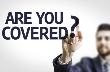 Business man pointing the text: Are you Covered?