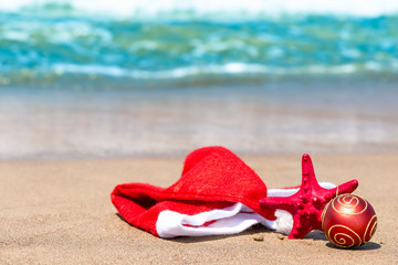 Christmas attributes and starfish on the beach