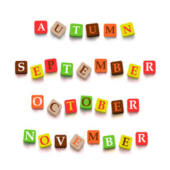 Words autumn, September, October, Novtember with colorful blocks