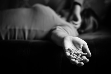 sad young girl holds in her hand a tablet