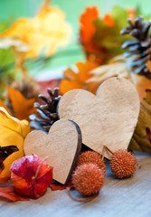 Two hearts in an autumn background