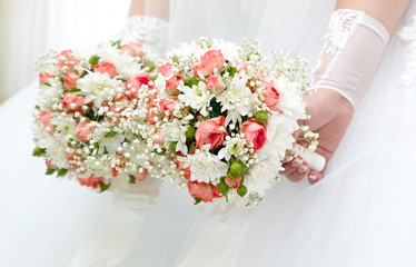 Wedding bunch of flowers in hands of the bride
