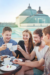 people enjoying coffee together with friends (focus on woman's e