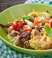 Baked vegetables (tomatoes, cauliflower, carrot) with mushrooms