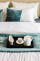 Fototapeta na wymiar tea set on black tray in modern bedroom