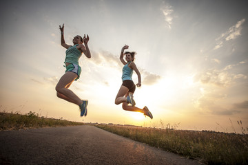 Fototapeta na wymiar Two pretty girls jogging in the morning