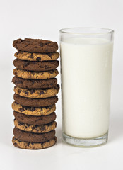 Milk glass  and cookies on white background