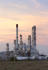 Oil refinery at twilight sky.