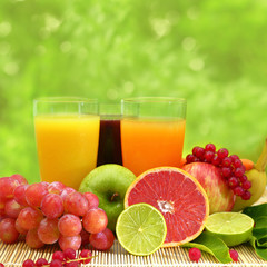 Fresh fruit and three glasses full of juice