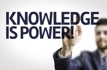Business man pointing the text: Knowledge is Power