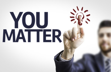 Business man pointing the text: You Matter