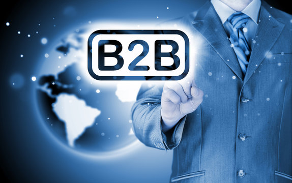 businessman pointing to word B2B