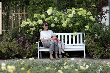 Family on a wooden bench