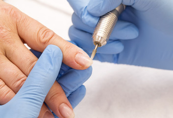 woman doing manicure beauty salon varnish wellness