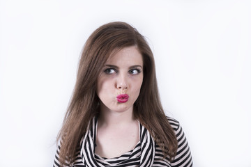 Naklejka premium Woman in studio giving a kiss (portrait, female, studio)