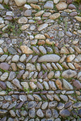 Italian old wall built with river stones
