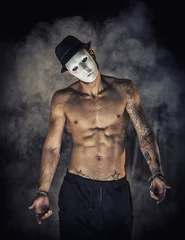 Acrylic prints Carnival Shirtless man dancer or actor with creepy, scary mask