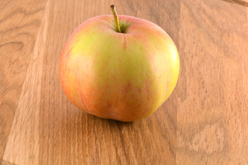 food concept - apple on a wooden board