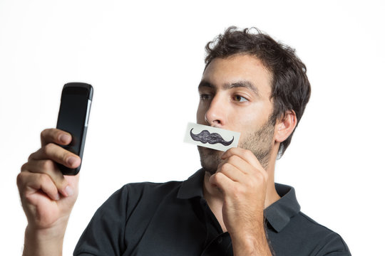casual man make selfie portrait with fake moustache