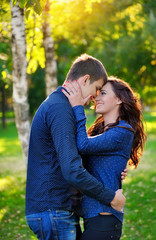 Close up portrait of young happy couple outdoors
