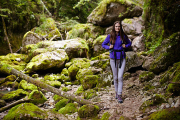 Hiker lady with backpack on trail