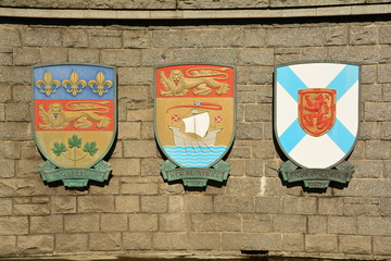 Coats of arms of Canadian provinces displayed on wall