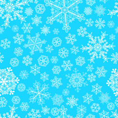 Christmas seamless pattern of snowflakes, white on light blue