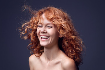 Naklejka premium red-haired girl with flying hair
