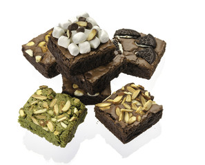Pieces of fresh brownie on white background