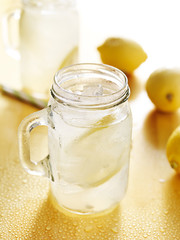 homemade lemonade in mason jar with straws to the side