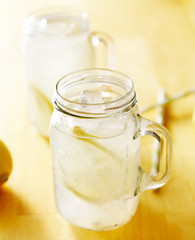 homemade lemonade in mason jar with straws to the side