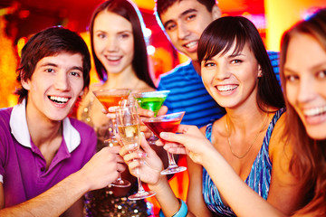 Guys and girls toasting