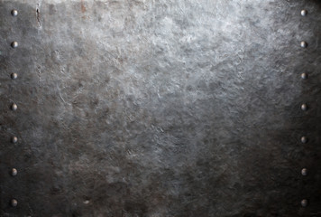 Obraz na płótnie Canvas Old metal plate with rivets