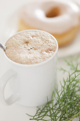 Cappuccino coffee with chocolate donut