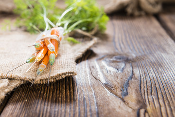 Carrot Injection on wooden background