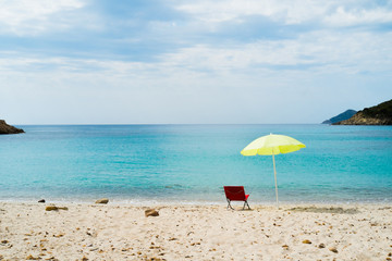 Beach umbrella and lounge chair