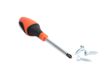 Phillips / cross head screwdriver and three screws, isolated