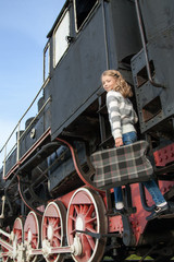 girls waiting for landing on the platform in  vintage train