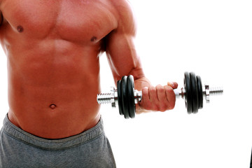 Closeup portrait of the man's body with dumbbell