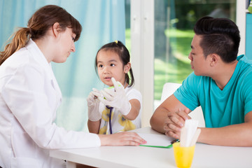 Asian family at pediatrician's office