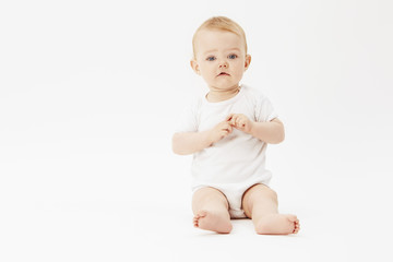 Portrait of young baby girl, studio.