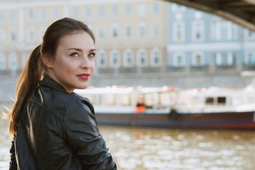 beautiful woman at river smiles