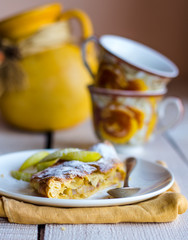 strudel dessert with pears on a white plate, .yellow napkin