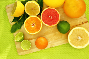 Fresh citrus fruit on a wooden tray