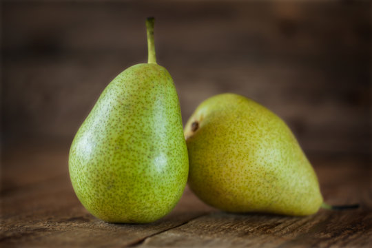 two  pears closeup on  wooden background