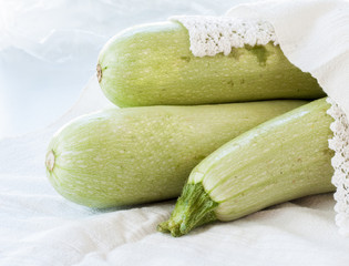 Raw on zucchini white background