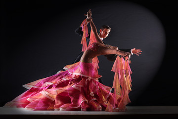 Latino dancers in ballroom isolated on black background